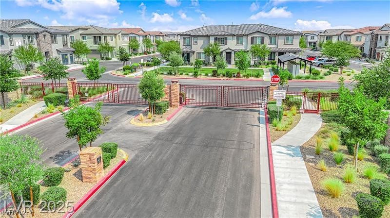 7308 North Decatur Boulevard, Unit 4 North Las Vegas, NV 89084 - Photo 29 of 34 View of front of property with a gate and a residential view