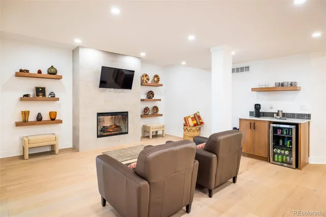 a living room with furniture fireplace and flat screen tv