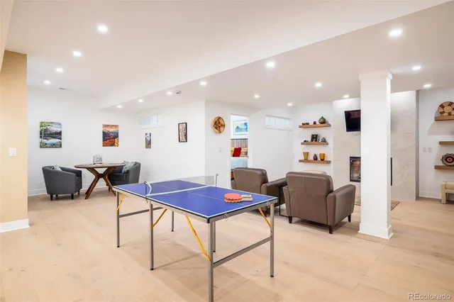 a living room with furniture a table and a flat screen tv