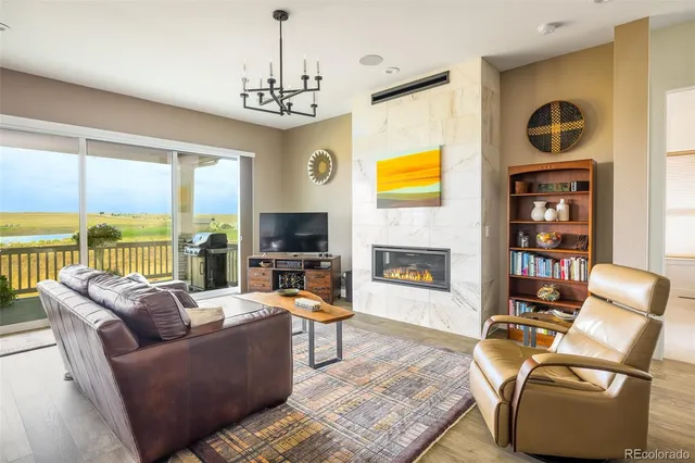 a living room with fireplace furniture and a flat screen tv