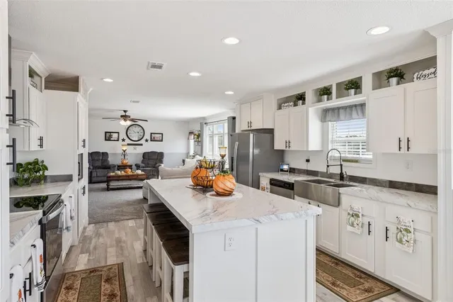 a stove top oven sitting inside of a kitchen