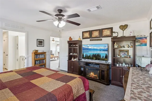 a room that has a bed and a dresser in it