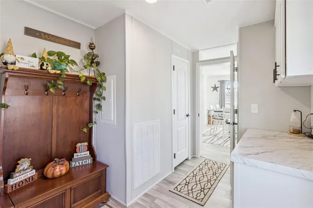 a bathroom with a double vanity sink toilet mirror and shower