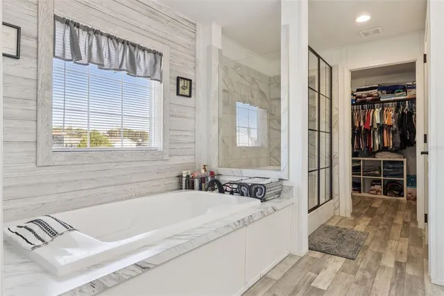 a kitchen with stainless steel appliances granite countertop a refrigerator and a stove