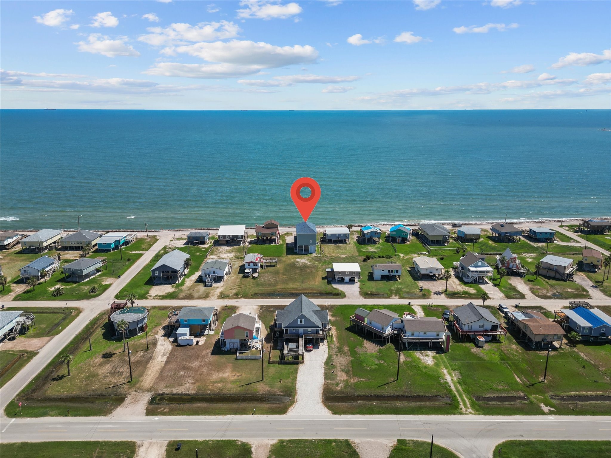 718 Beach Drive Surfside Beach, TX 77541 - Photo 3 of 49 Discover your dream beachfront lifestyle in this charming coastal neighborhood. Enjoy stunning ocean views and easy access to the shore, all within a well-planned community. Perfect for those seeking tranquility by the sea.