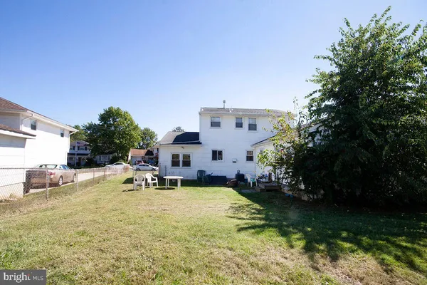 a view of a house with swimming pool and sitting area