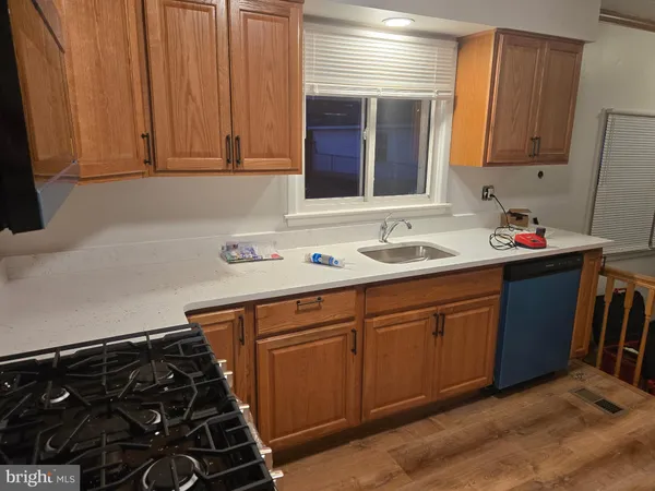 a kitchen with sink and cabinets