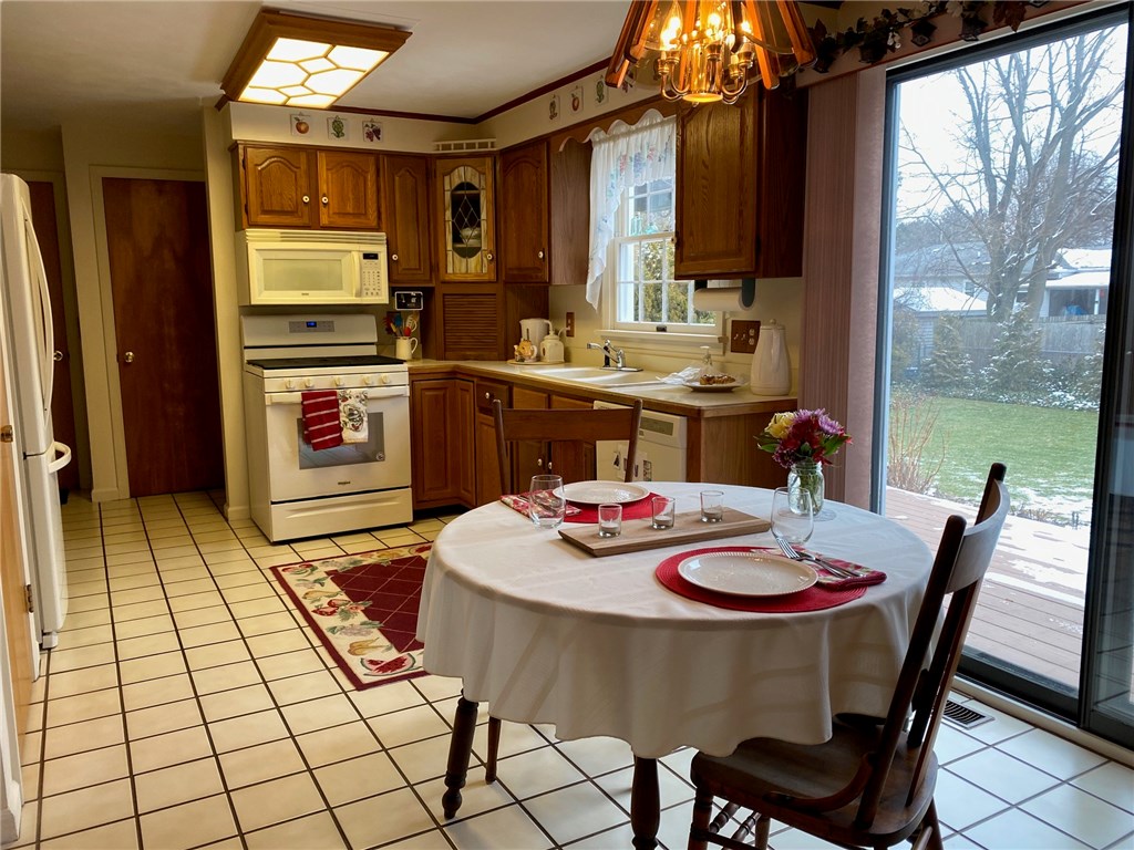 14 Sandhurst Drive Irondequoit, NY 14617 - Photo 10 of 44 Eat in kitchen with sliding glass doors to rear de