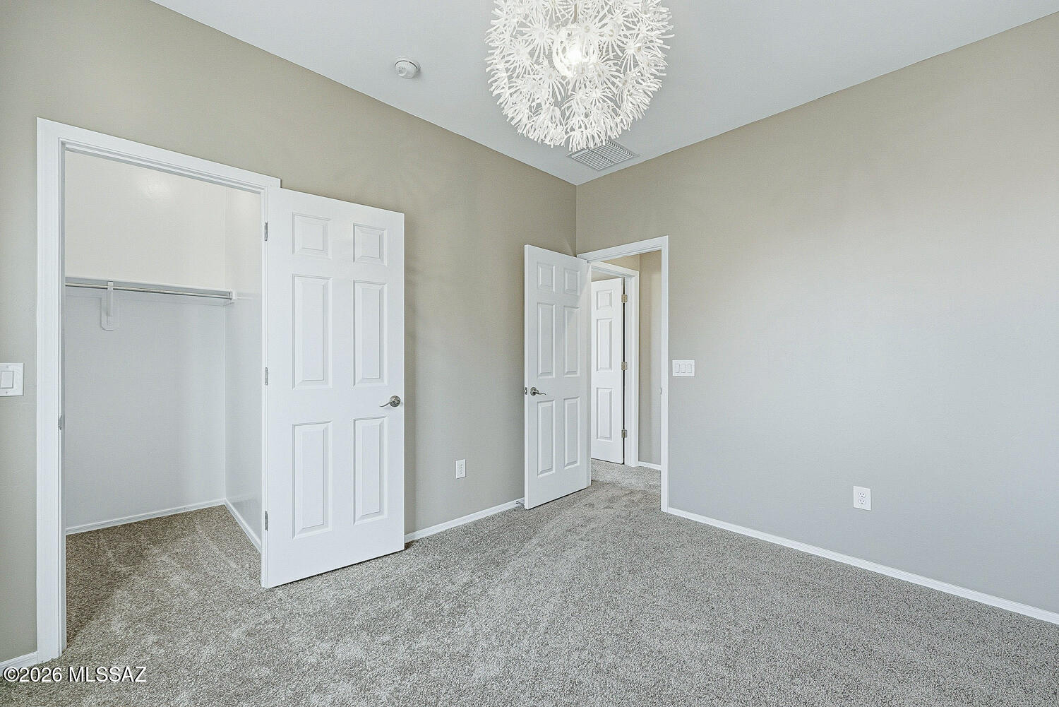 323 East Refuge Loop Vail, AZ 85641 - Photo 33 of 51 an empty room with a chandelier fan
