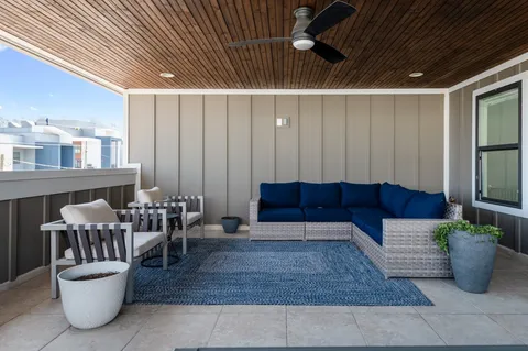 a view of a porch with a floor to ceiling window