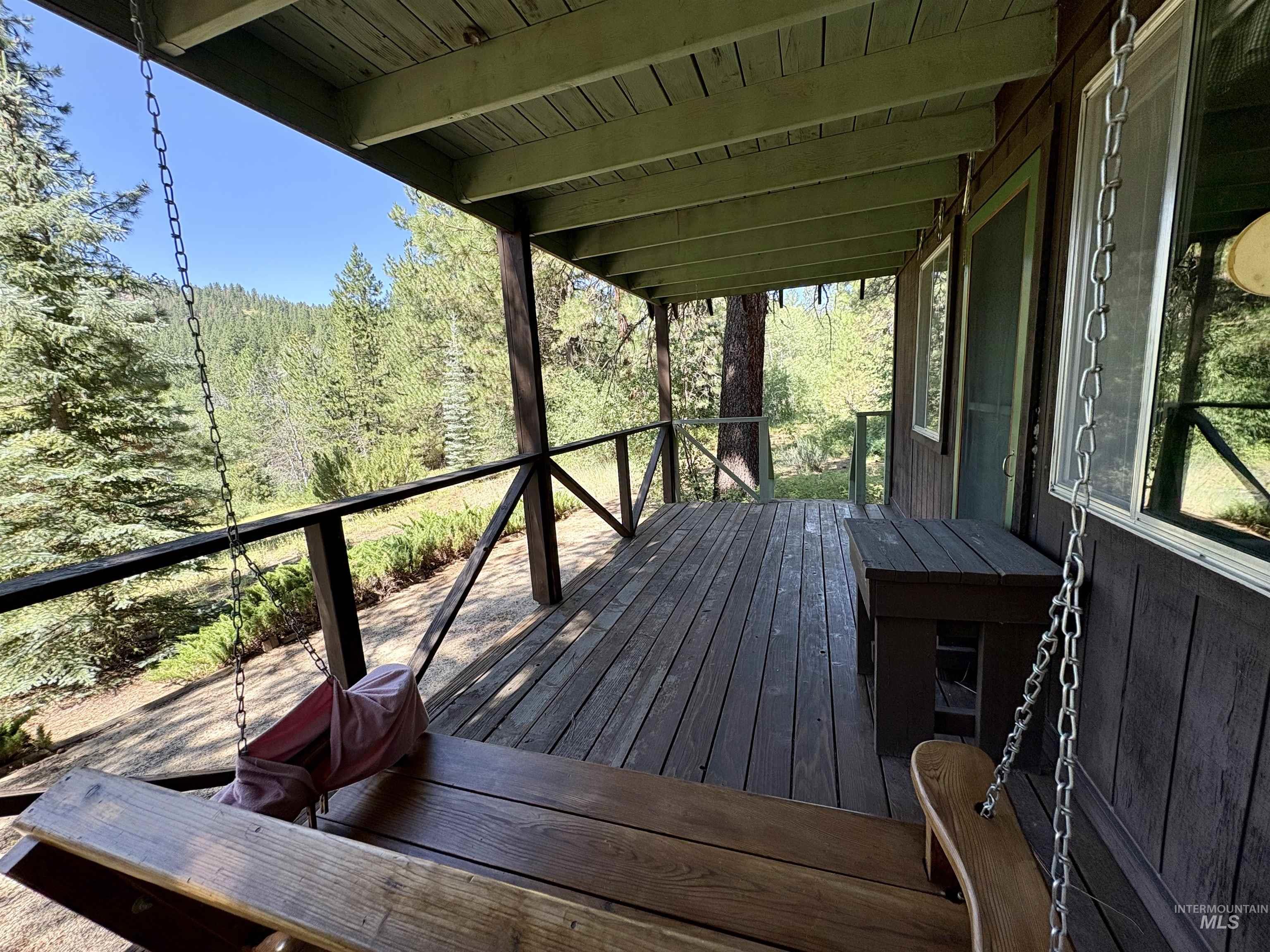 1100 Strawberry Loop Road Mountain Home, ID 83647 - Photo 13 of 20 A-frame style cabin exterior featuring dark wood siding