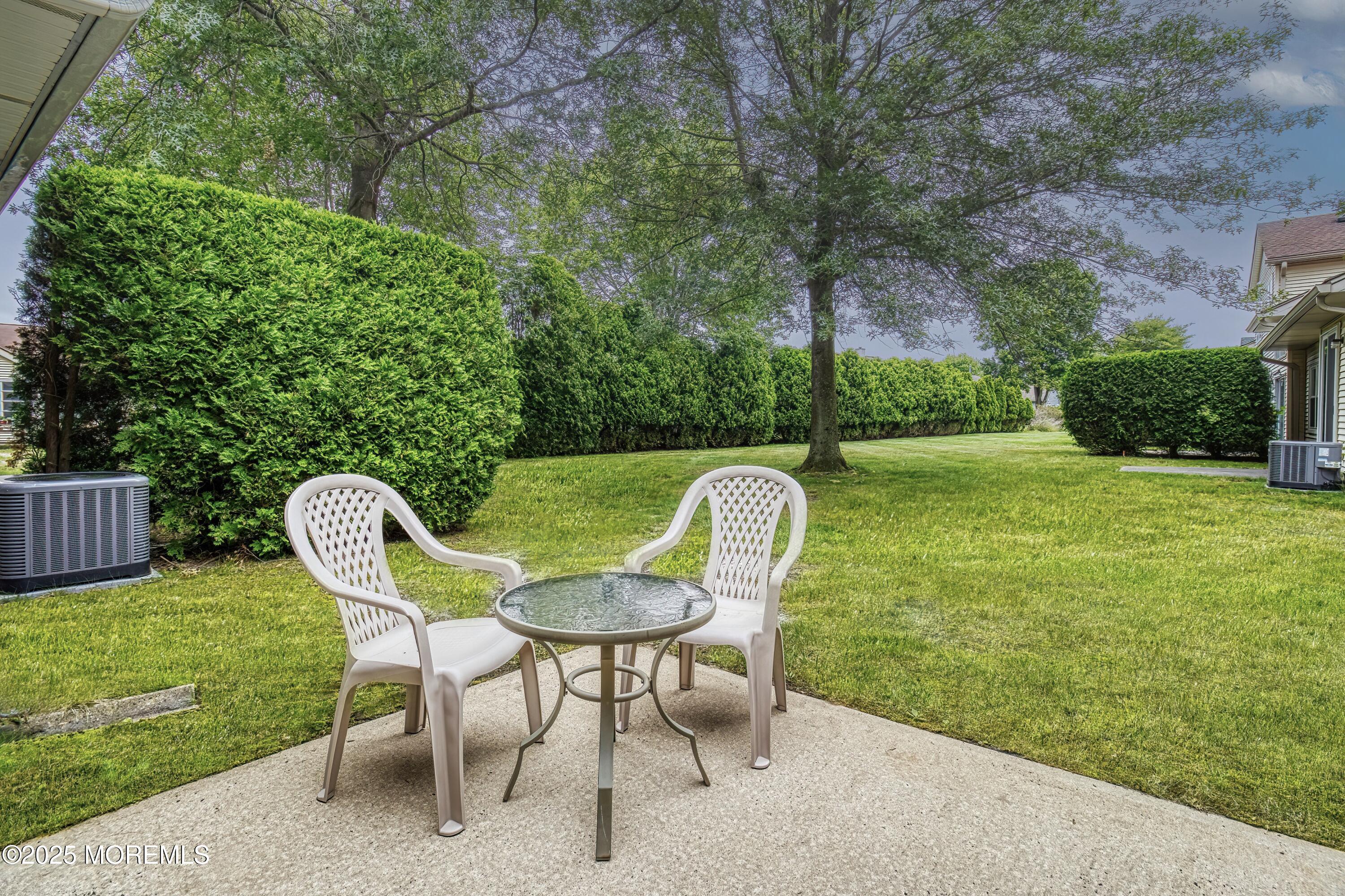 11 Riva Boulevard Brick, NJ 08723 - Photo 11 of 42 a view of a chair and table in backyard of the house