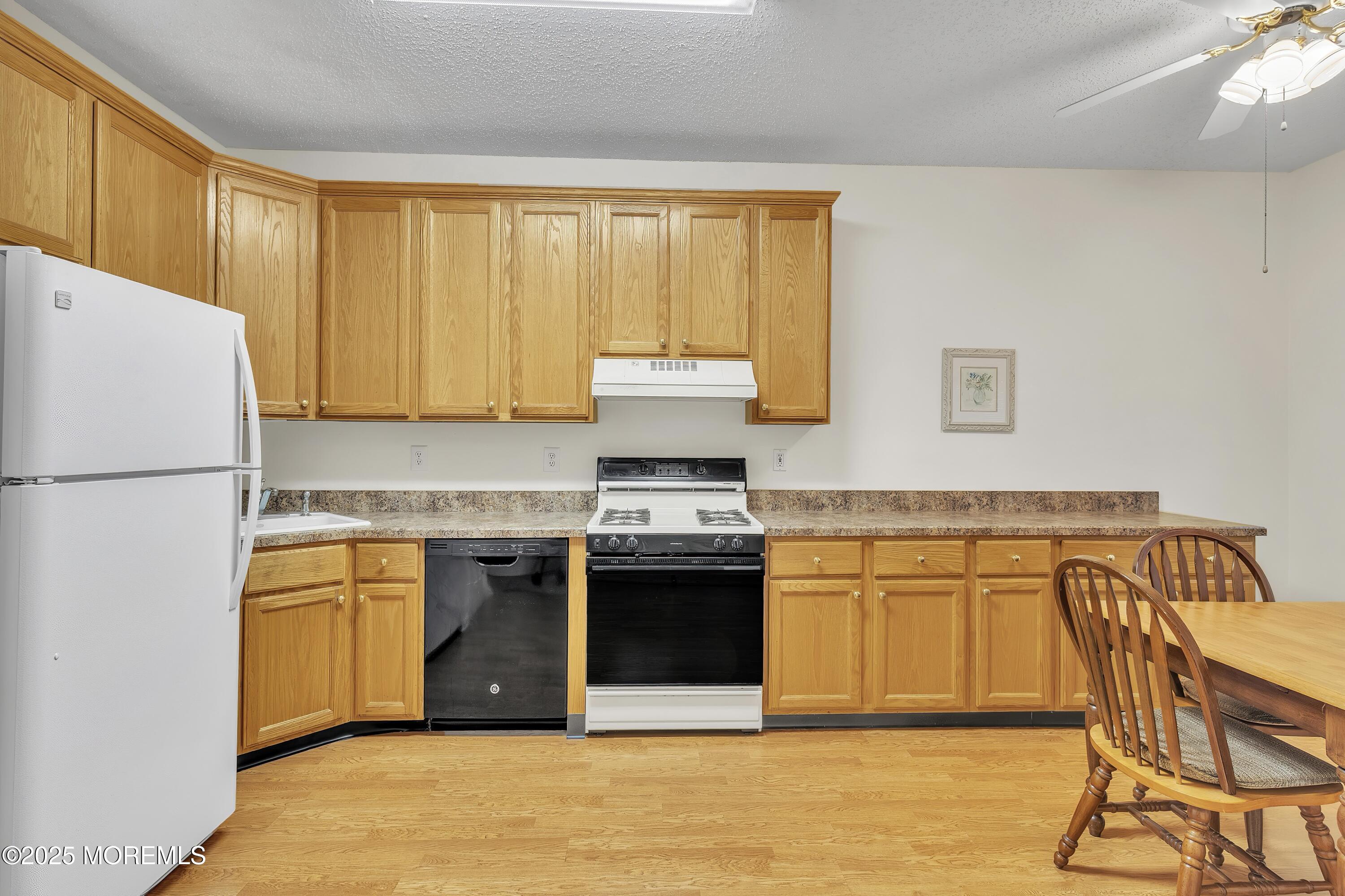 11 Riva Boulevard Brick, NJ 08723 - Photo 13 of 42 a kitchen with stainless steel appliances granite countertop a stove a sink and a refrigerator