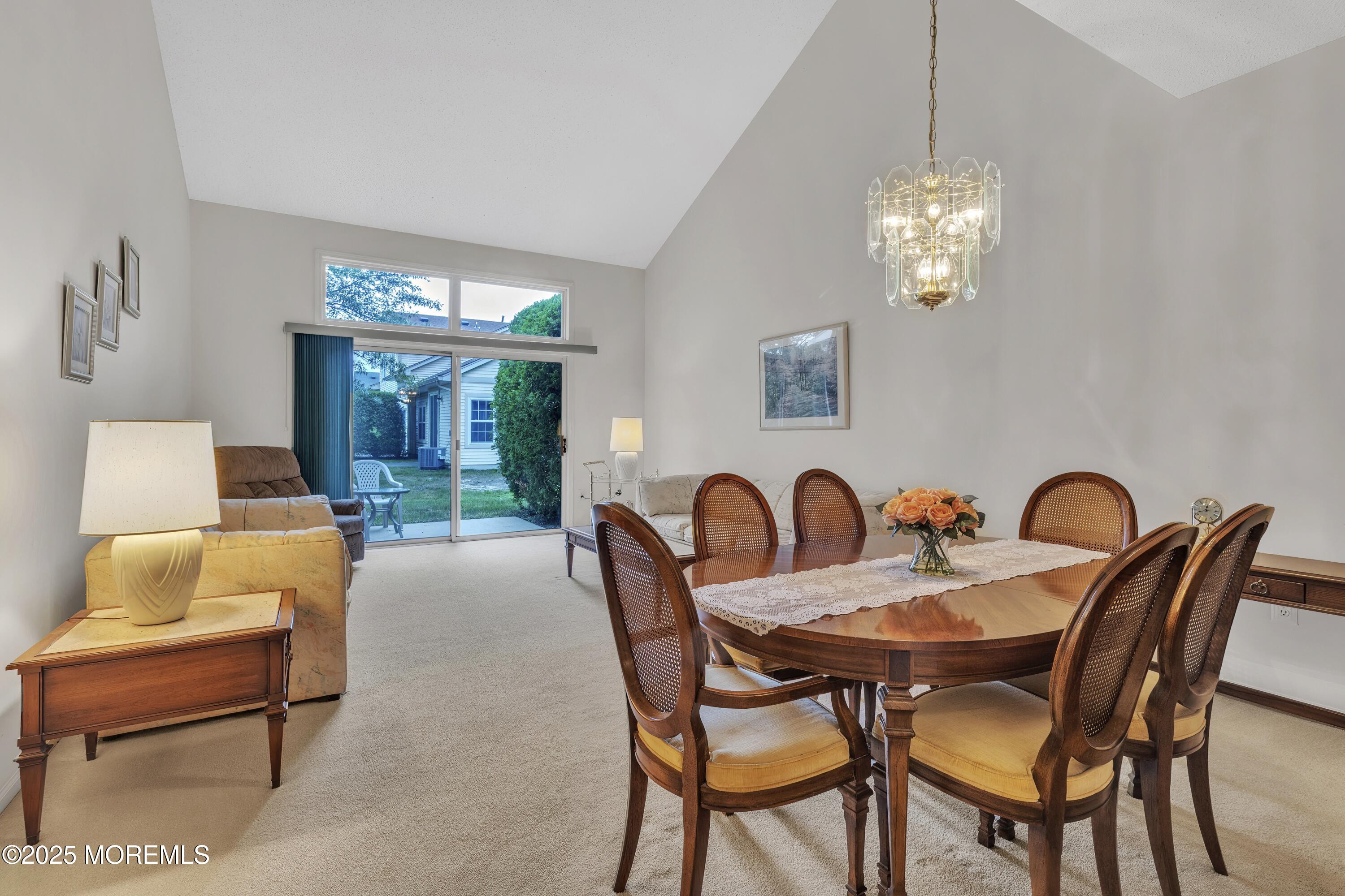 11 Riva Boulevard Brick, NJ 08723 - Photo 17 of 42 a dining room with furniture a chandelier and window