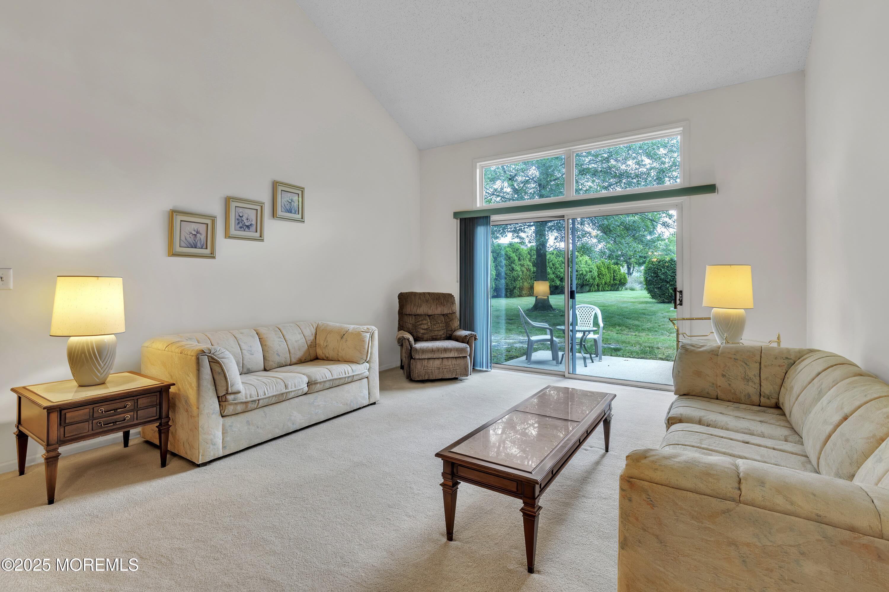 11 Riva Boulevard Brick, NJ 08723 - Photo 19 of 42 a living room with furniture and a large window