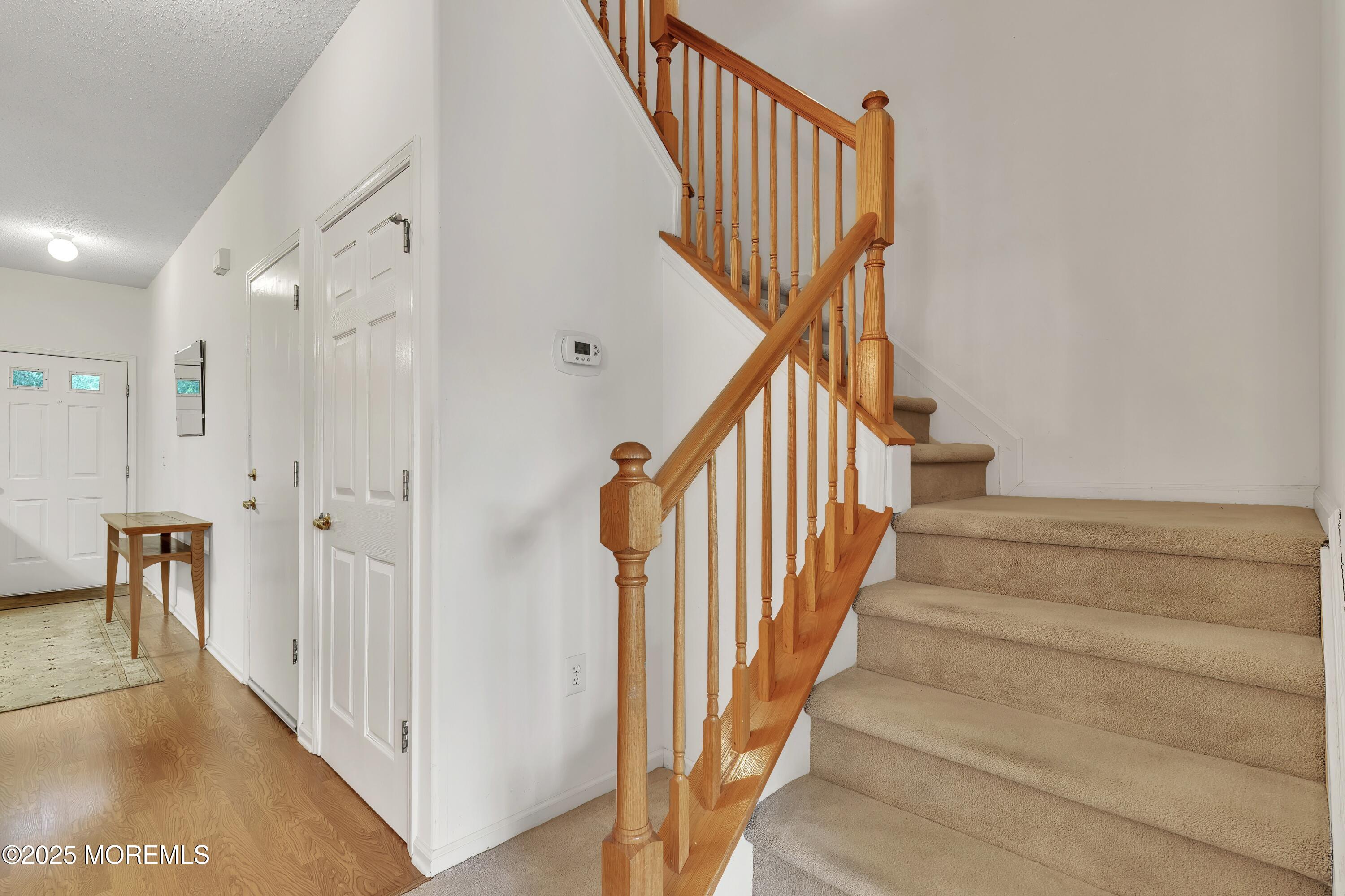 11 Riva Boulevard Brick, NJ 08723 - Photo 22 of 42 a view of staircase with railing and white walls