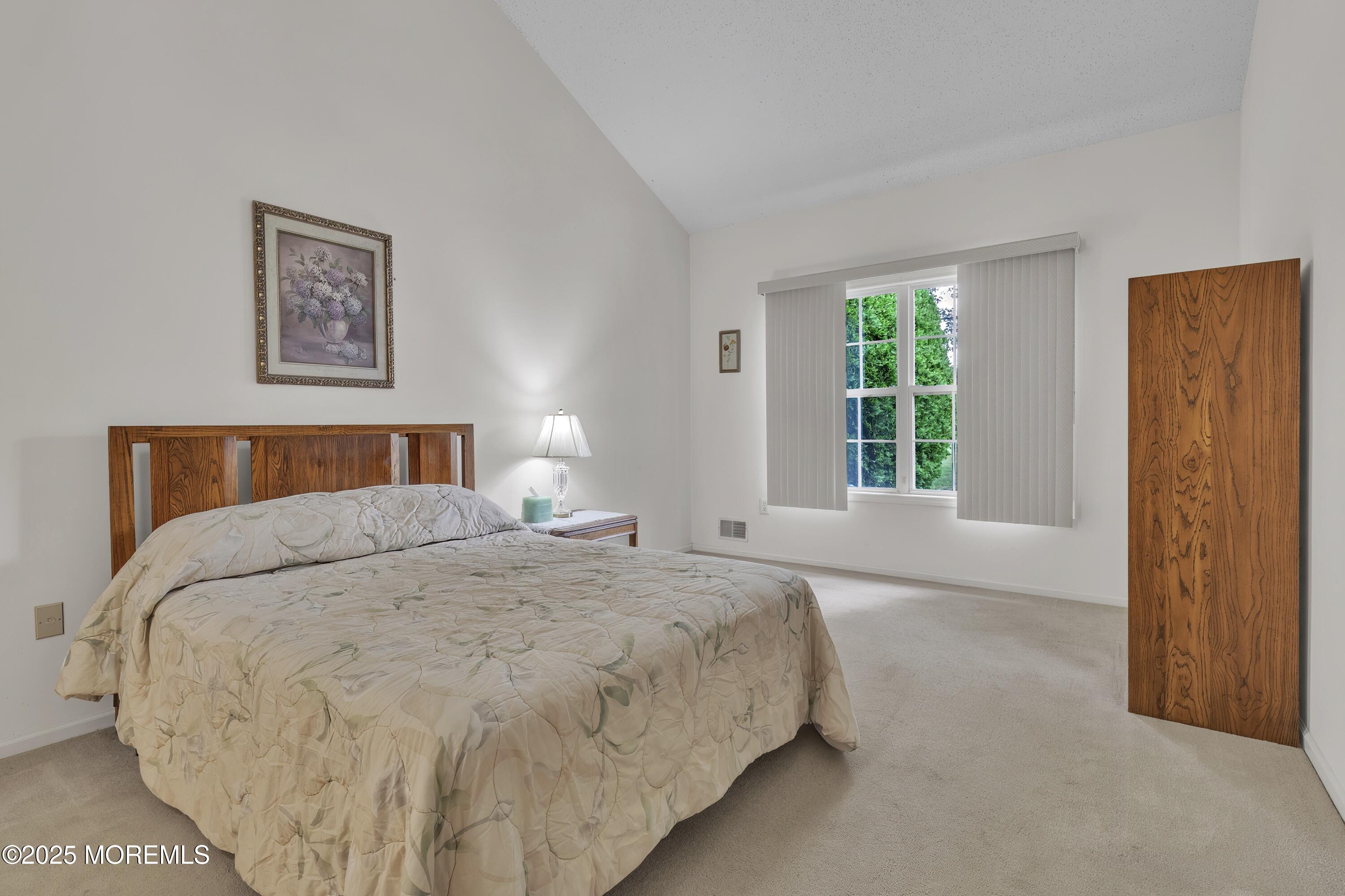 11 Riva Boulevard Brick, NJ 08723 - Photo 24 of 42 a bedroom with a bed and a window