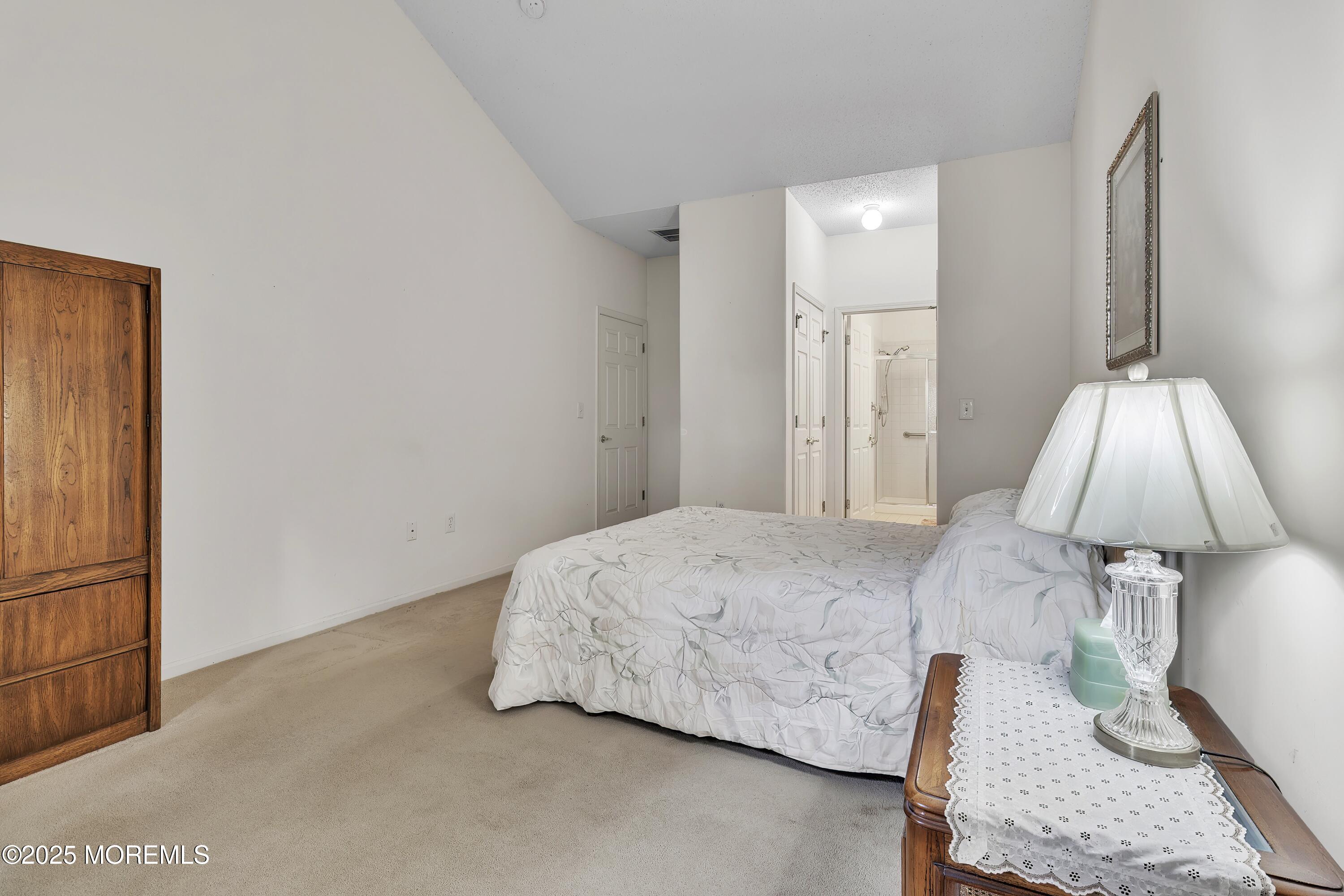 11 Riva Boulevard Brick, NJ 08723 - Photo 25 of 42 a bed room with a bed and a lamp