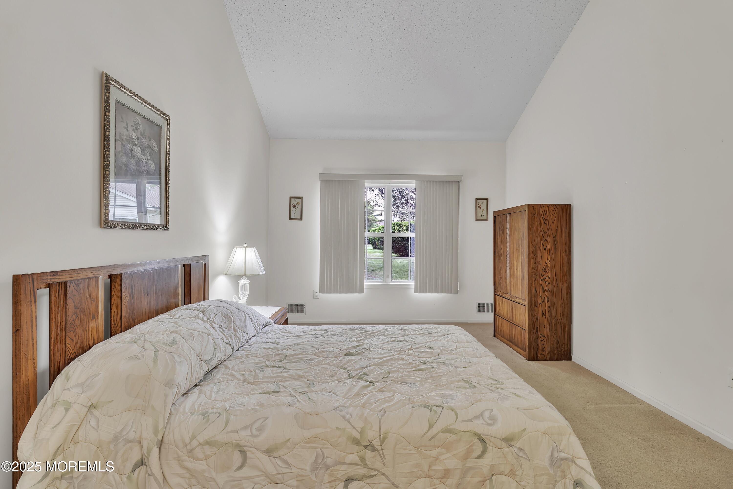 11 Riva Boulevard Brick, NJ 08723 - Photo 27 of 42 a bedroom with a bed and a window