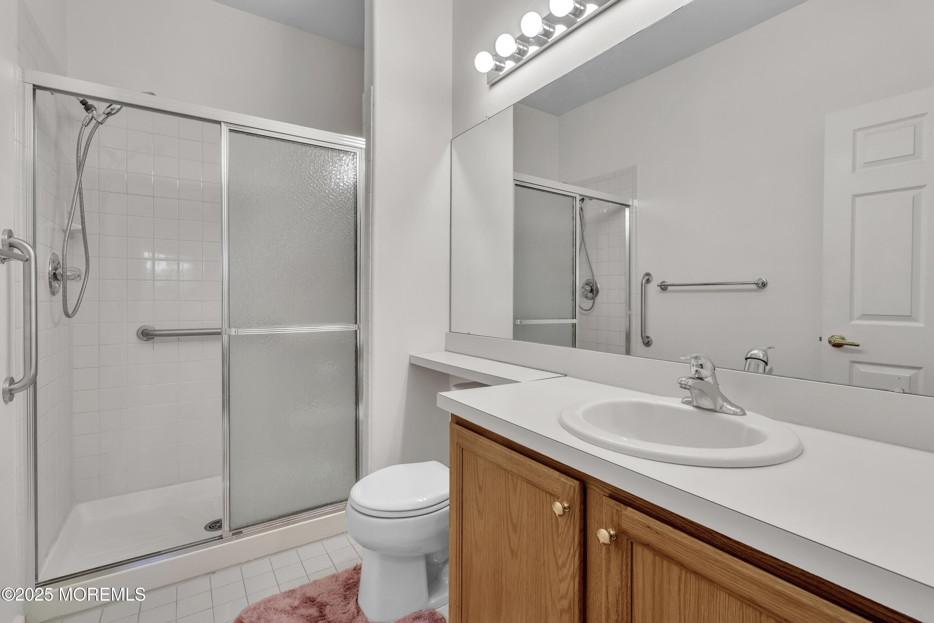 11 Riva Boulevard Brick, NJ 08723 - Photo 29 of 42 a bathroom with a sink toilet and shower