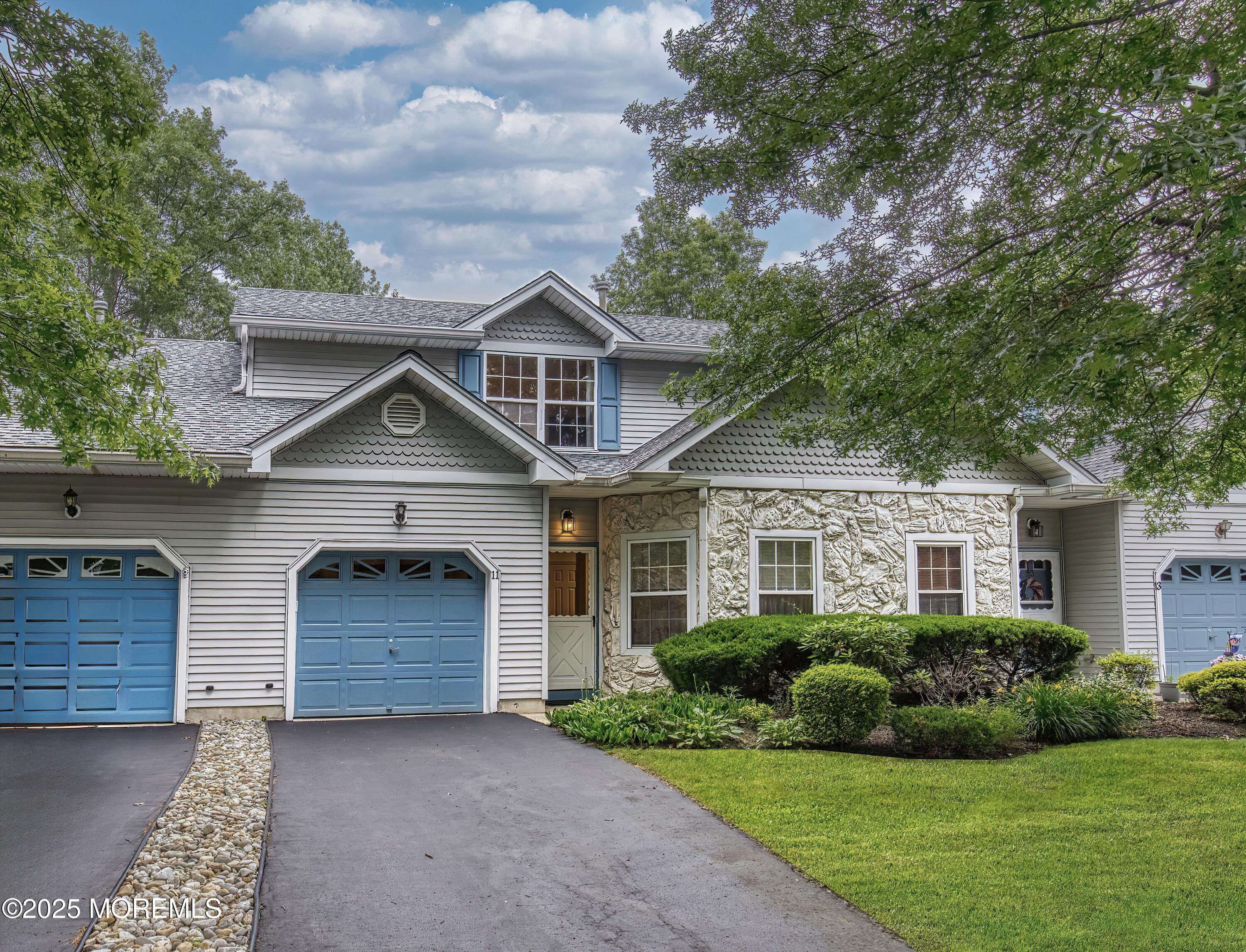 11 Riva Boulevard Brick, NJ 08723 - Photo 3 of 42 a front view of a house with a yard