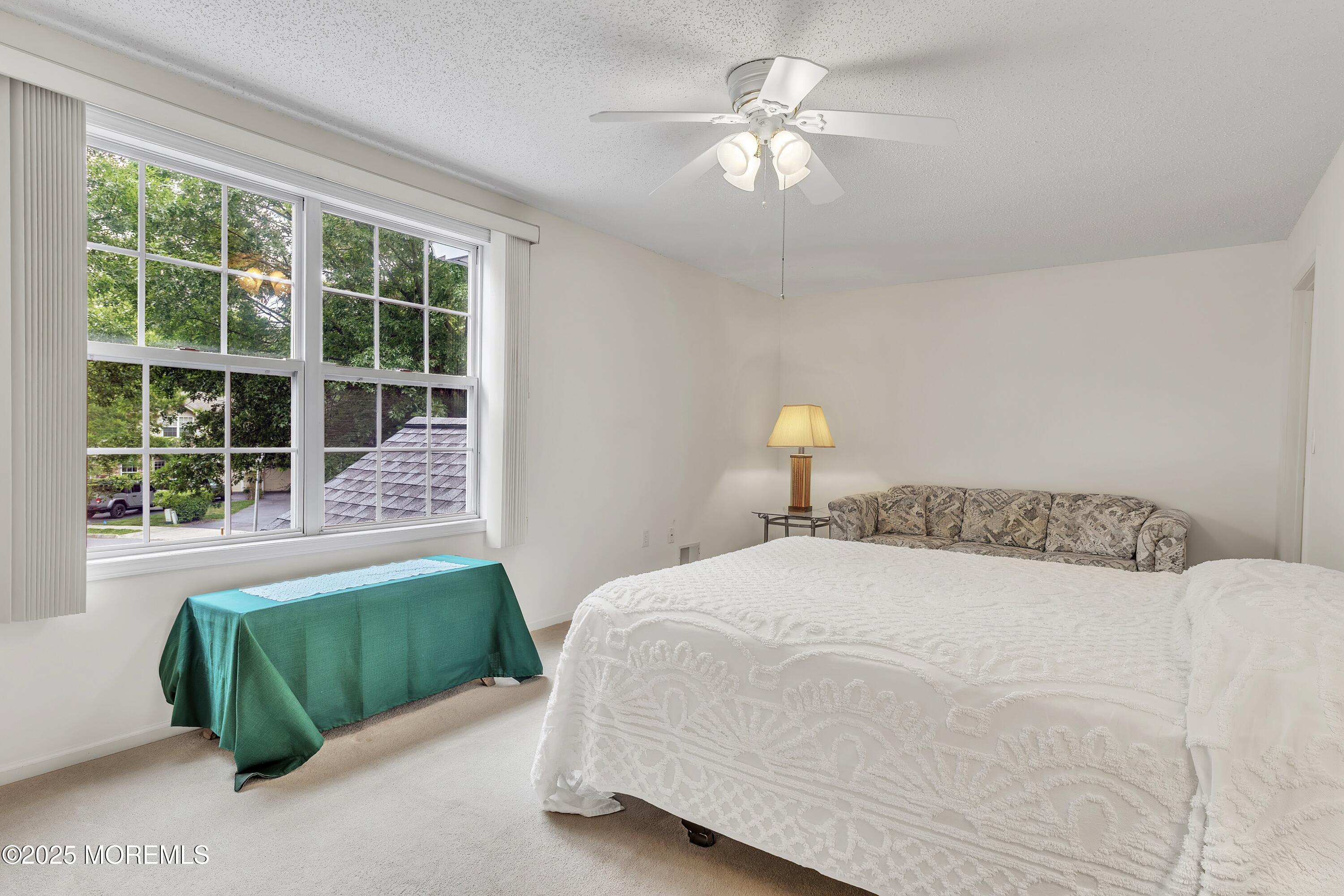 11 Riva Boulevard Brick, NJ 08723 - Photo 34 of 42 a bedroom with a large bed and a window