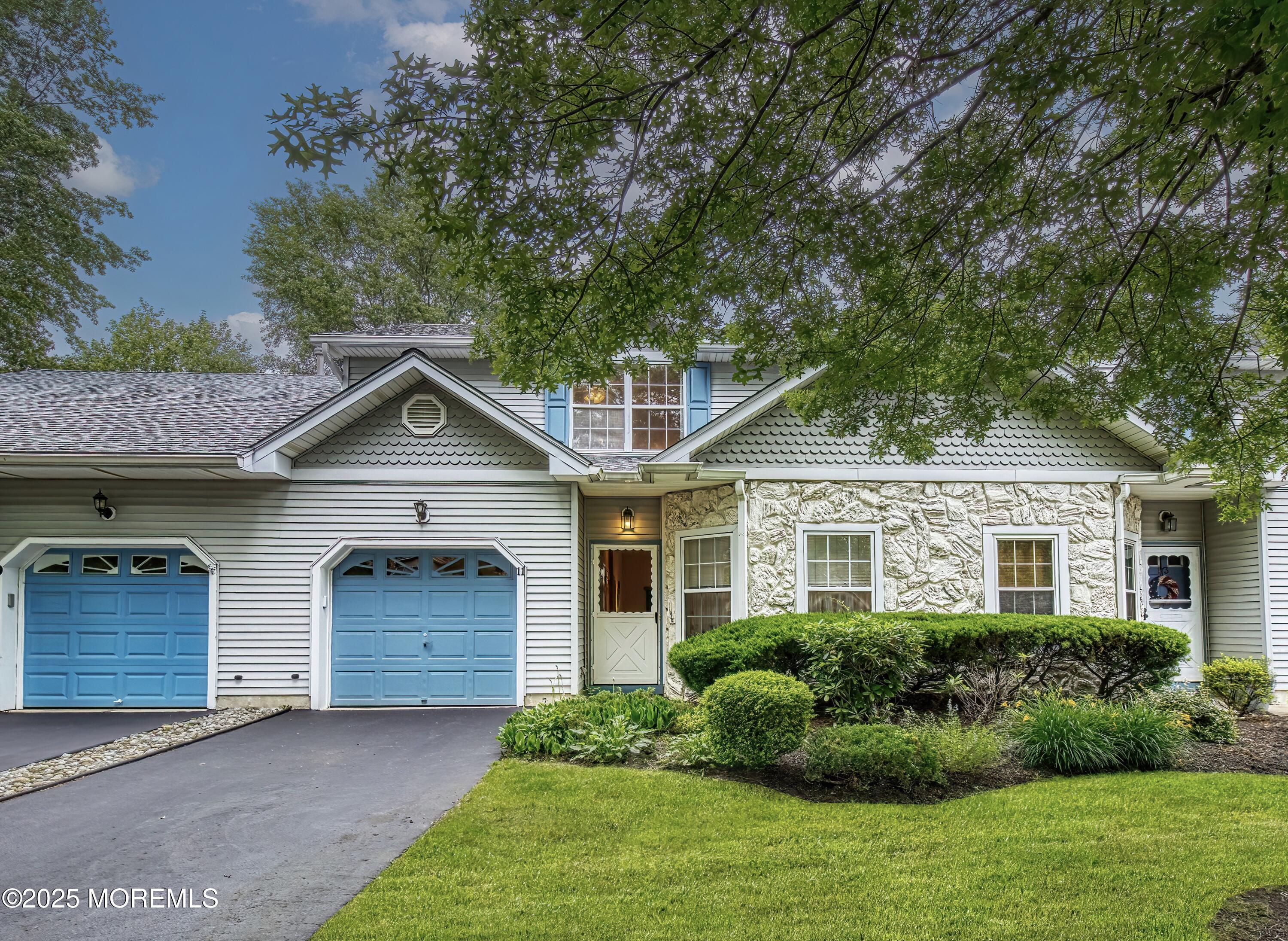 11 Riva Boulevard Brick, NJ 08723 - Photo 4 of 42 a front view of a house with a yard