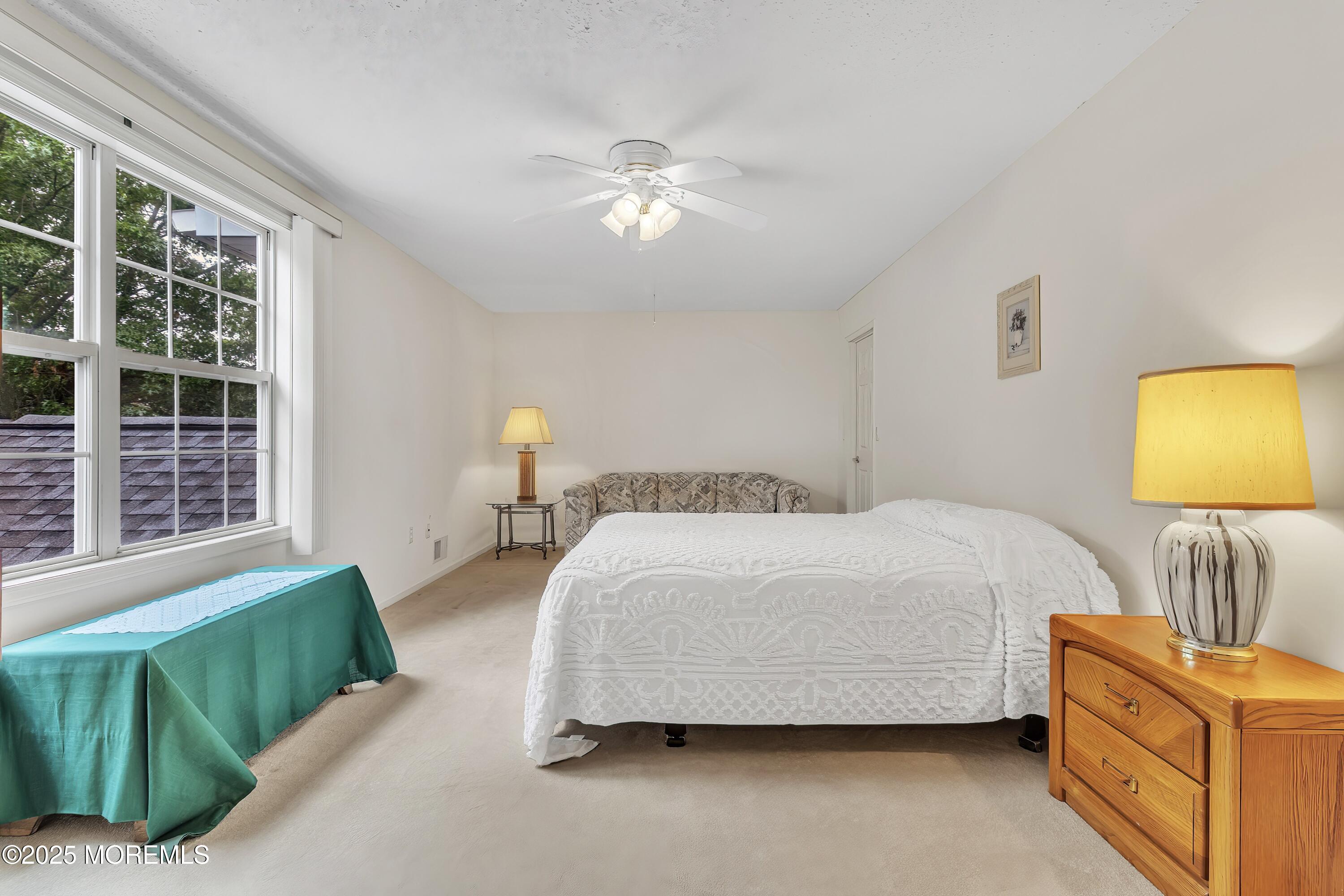 11 Riva Boulevard Brick, NJ 08723 - Photo 41 of 42 a bedroom with a bed and window