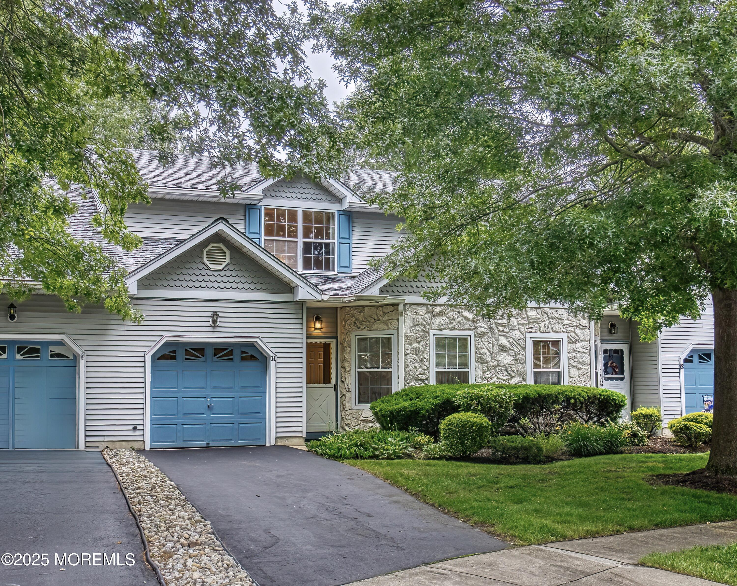 11 Riva Boulevard Brick, NJ 08723 - Photo 6 of 42 a front view of a house with a yard