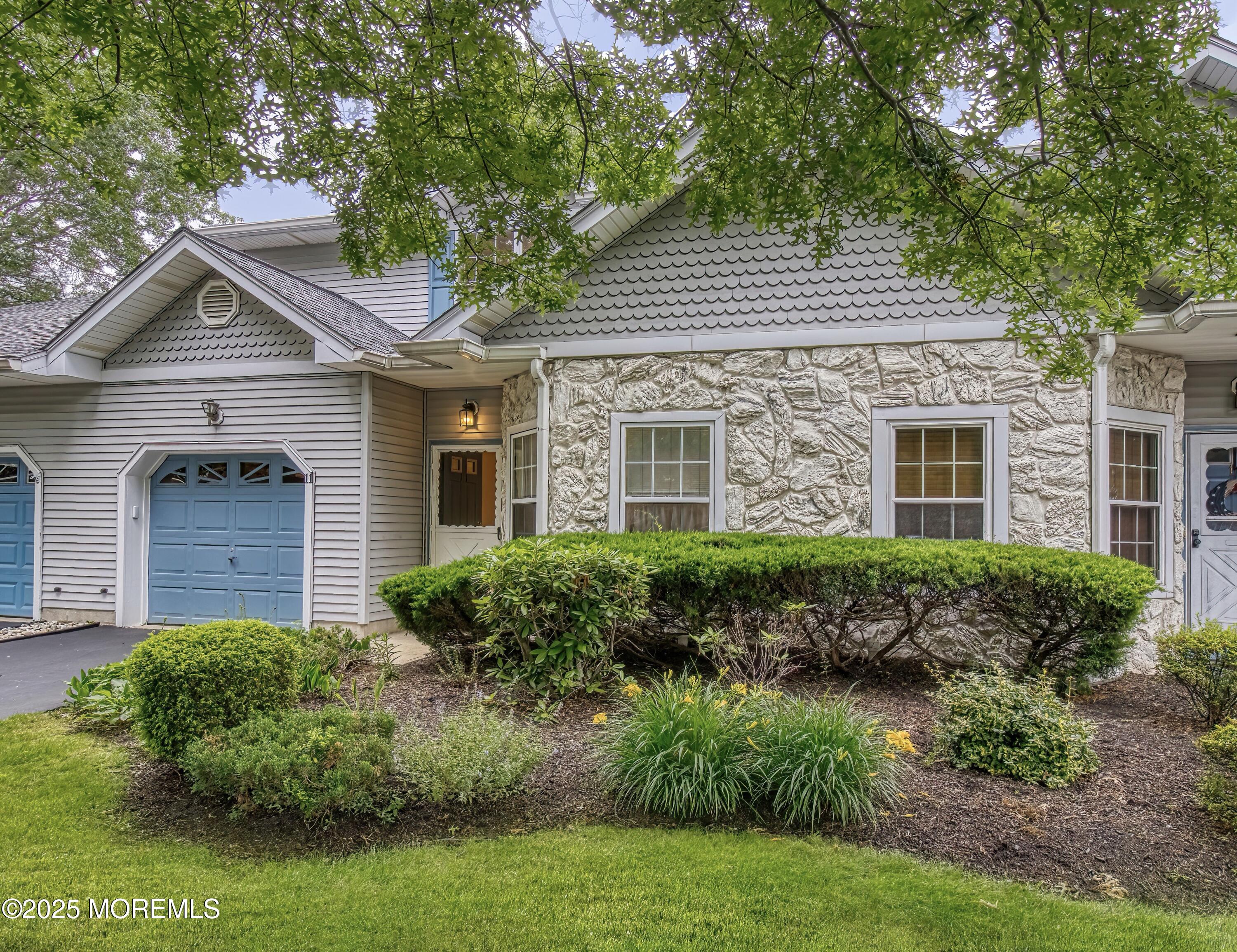 11 Riva Boulevard Brick, NJ 08723 - Photo 8 of 42 a front view of a house with garden