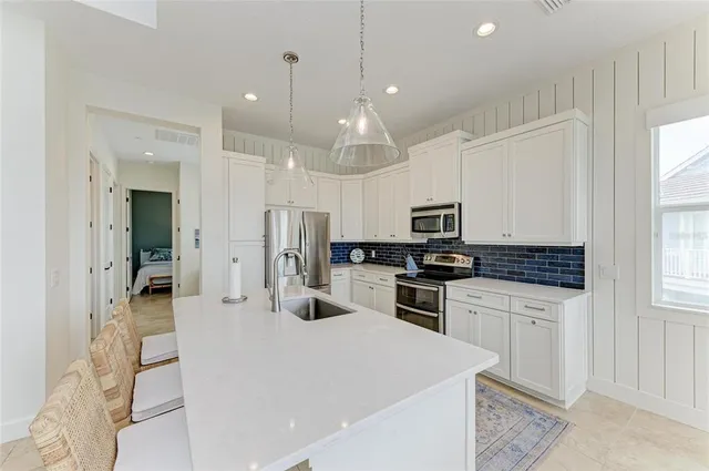 a living room with furniture and a walk in closet