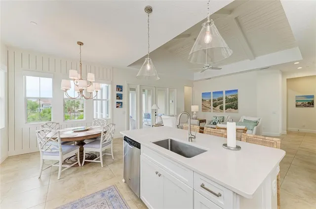 a bathroom with a granite countertop sink a toilet a mirror and shower