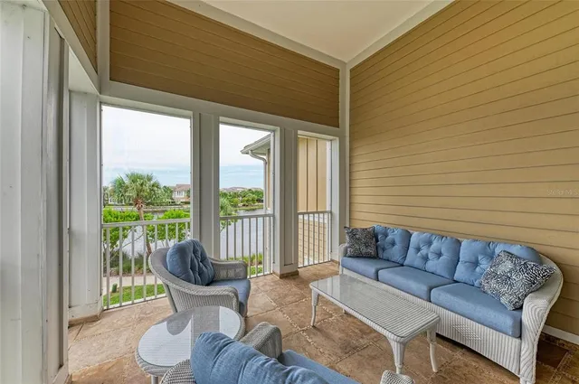 a aerial view of a house with a yard and lake view