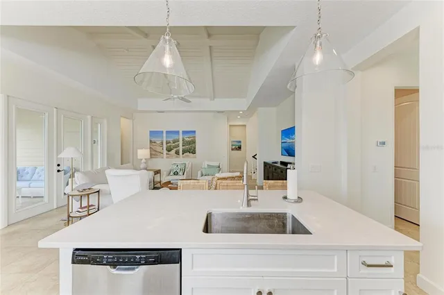 a living room with lots of furniture and hard wood flooring