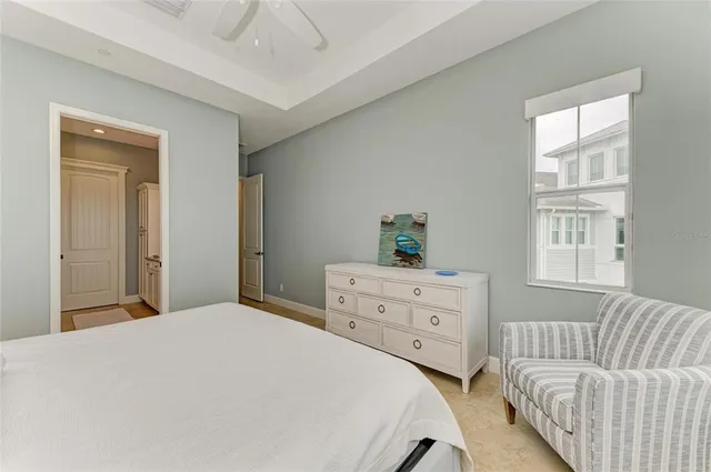 a living room with furniture and a book shelf