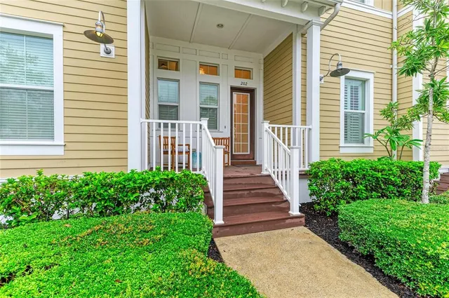 a living room with furniture and a view of kitchen