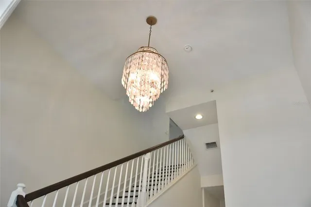 a kitchen with stainless steel appliances granite countertop a sink refrigerator and microwave