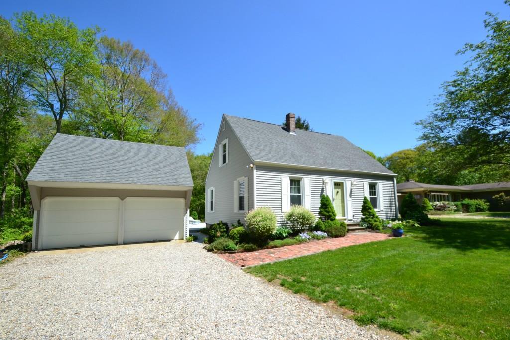 244 Flanders Road Stonington, CT 06378 - Photo 1 of 1 a front view of a house with a garden