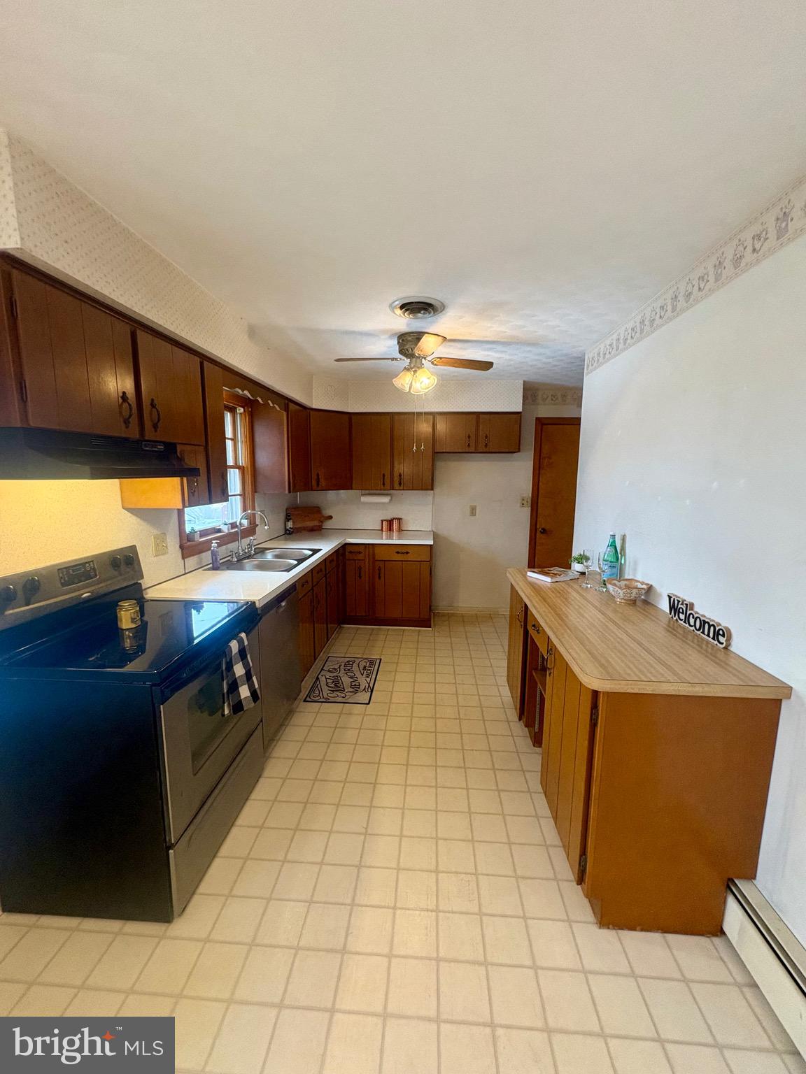 100 Clover Hill Road Dallastown, PA 17313 - Photo 13 of 20 a kitchen with stainless steel appliances granite countertop a sink counter space and cabinets