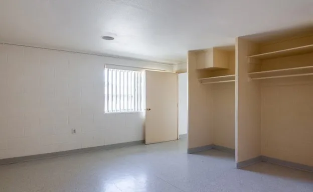 a view of an empty room with a window