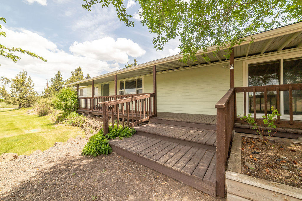 61395 Ward Road Bend, OR 97702 - Photo 25 of 56 a view of a house with backyard and sitting area