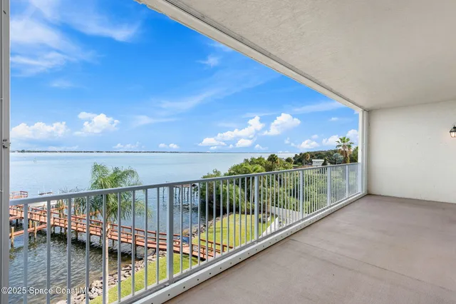 a view of balcony with furniture