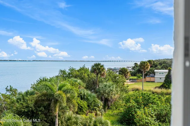 a view of a lake with a building in the background