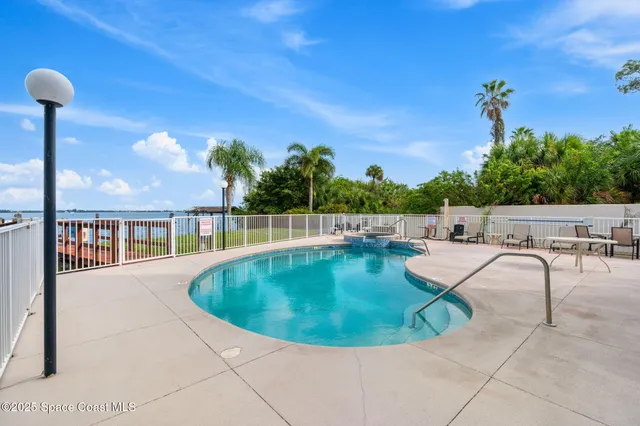 a view of a swimming pool with a patio