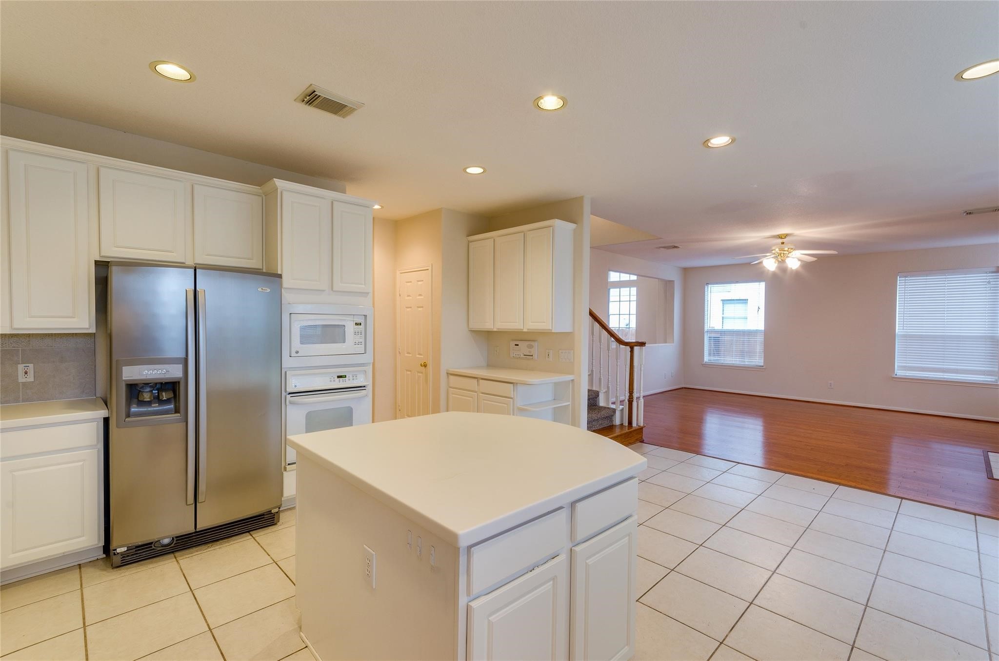 4019 Angel Spring Drive Sugar Land, TX 77479 - Photo 17 of 50 a kitchen with stainless steel appliances a refrigerator sink and microwave