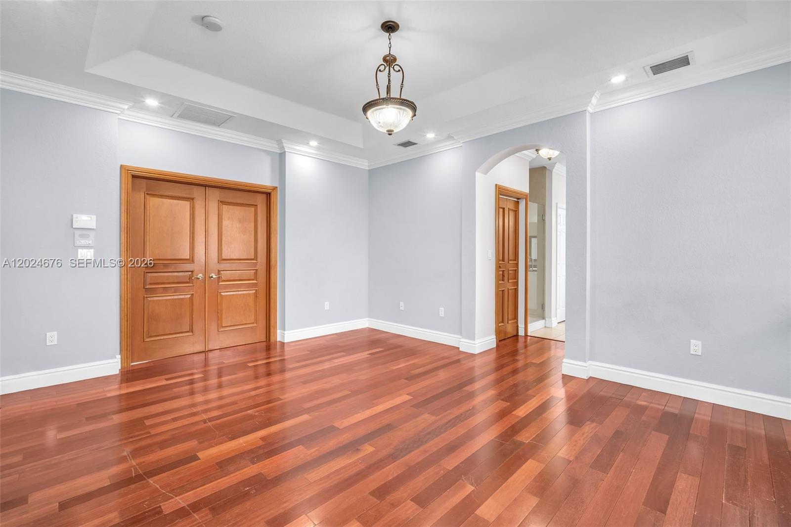 2155 Southwest 156th Court Miami, FL 33185 - Photo 42 of 57 a view of an empty room with wooden floor and windows