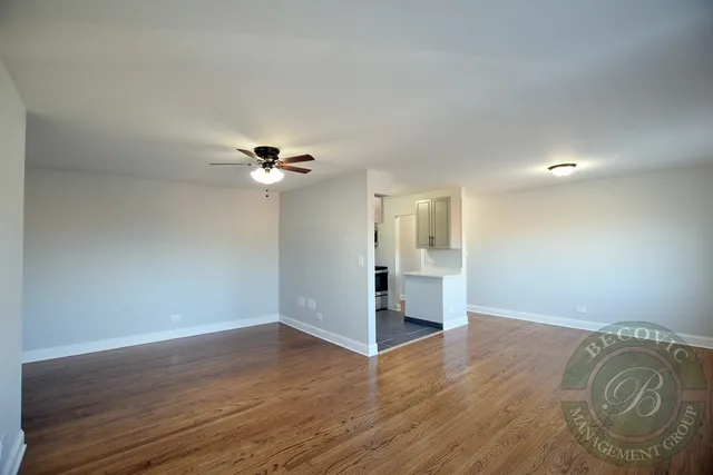a view of a livingroom with wooden floor