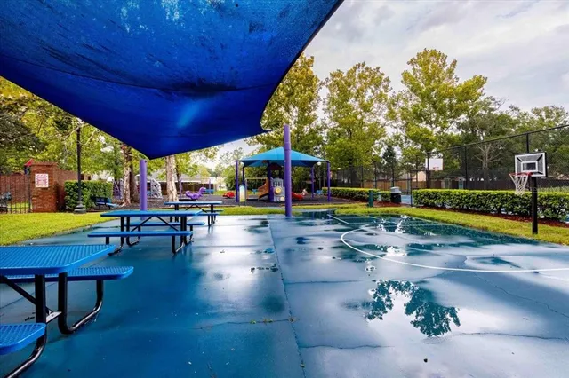 a view of a swimming pool with sitting area