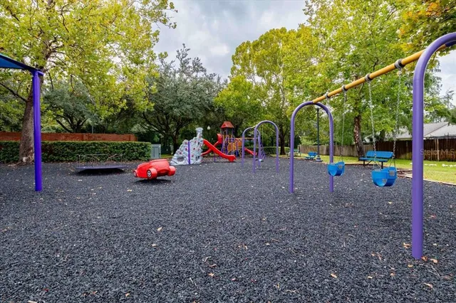 a view of a park with swings