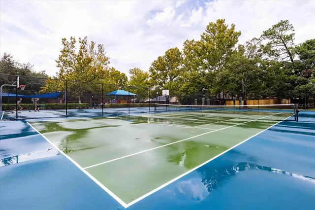 a view of a swimming pool with a lawn chairs
